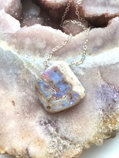 "A raw piece of genuine Opal was made into a Opal pendent and strung on a dainty 16\" strong Sterling silver chain. This pendent is so unique and absolutely beautiful. Perfect gift for an October birthday. This is the necklace you will receive Purple Opal with multi colors The Opal is one of the most beautiful stones to see 💙 The stone inspires Hope Love Purity Luck Happiness Handcrafted Raw Opal Gemstone Pendant Necklace *Raw stones offer stunning unique characteristics *Soothing shades of Pur Opal Gifts, Purple Opal, October Birthstone Jewelry, Raw Stone Necklace, Raw Crystal Jewelry, October Birthday, Gemstone Pendant Necklace, Birthday Gift For Women, Opal Pendant Necklace