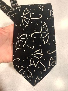 Vintage Henry Company necktie made in UsA  100% Cotton black tie with Ivory umbrellas and rain Black Umbrella, Tie Accessories, Suit And Tie, Necktie, Black Tie, Neck Tie, Made In Usa, Umbrella, The 100