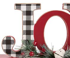 the letter o is decorated with christmas decorations