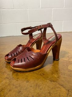 True 1970's vintage Zodiac wooden heels in excellent condition no rotting leather or loose sole + VERY comfy. True to a size 6.5. Retro Brown Platform Heels, Vintage Brown Closed Toe Clogs, Vintage Brown Clogs With Round Toe, Brown Almond Toe Heels With Wooden Heel, Vintage High Heel Clogs With Leather Sole, Vintage Clogs With Leather Sole And Closed Toe, Vintage Closed Toe Clogs With Leather Sole, Vintage Leather Sole Closed Toe Clogs, Vintage Brown Open Toe Clogs