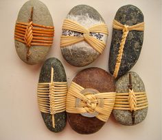 several different types of rocks with ribbons on them