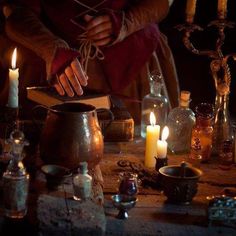 a table topped with candles and other items