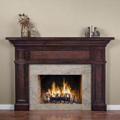 a fire place in a living room with wood flooring