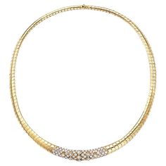 A prestigious piece by Van Cleef & Arpels, this flexible collar necklace is pavé set with an opulence of white diamonds, weighing approximately 5.6 carats , all finely mounted in 18 karat yellow gold. weight of the necklace is 115 gm. Center Plaque is set with round brilliant cut and princess cut diamonds 82 round diamonds , 4.5 ct 9 Princess cut diamonds 1.10 Ct Signed Van Cleef & Arpels. # 50751 Luxury Gold-plated Yellow Gold Choker, Luxury Yellow Gold Necklace For Ceremonial Occasions, Classic Formal Diamond Choker Necklace, Luxury Diamond Choker For Formal Occasions, Luxury Formal Choker With 17 Jewels, Formal Luxury Choker With 17 Jewels, Luxury Diamond Choker Jewelry, Elegant Diamond Tennis Necklace With Pave Setting, Elegant Diamond Choker For Formal Events