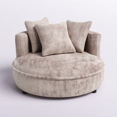 a round couch with pillows on it