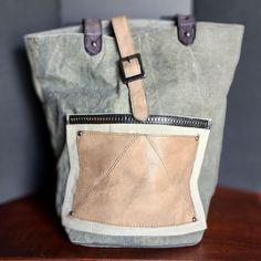 Due To A Family Emergency, I Find Myself Needing To Sell My Designer Handbag Collection. Please View My Other Items. There Will Be More Posted Everyday. All Offers Are Welcome. Pet Free / Smoke Free *Discounted Shipping* Nwot Moto Glam Tote Bag By Mona B This Bag Has Been Stored Since Purchased. The Only Blemish Is ~4 Stitches On The Corner Of The Back Pocket Did Not Sew. It Came That Way. Given The Upcycled Nature Of Mona B Items, It Is Not Noticeable And Does Not Alter Function In Any Way. A R Vintage Canvas Hobo Tote Bag, On-the-go Bucket Bag In Coated Canvas, Khaki Canvas Hobo Bag For Travel, Green Canvas Satchel With Removable Pouch, Practical Canvas Bag With Double Handle, Daily Coated Canvas Backpack, Khaki Backpack For Everyday Use, Everyday Khaki Canvas Bag, Green Coated Canvas Bag With Leather Handles