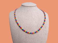 this discrete pride flag seed bead necklace is the cutest accessory for celebrating your pride and allegiance! this necklace is absolutely perfect for those who are out-and-proud and for those who are still in the closet! <3 **packaging is completely discreet * the item(s) you receive will always be slightly different from the picture since every item is custom, unique, and handmade to order. please allow for small variations in each product * necklace length: 14in + 2in chain extender, 16in + 2 Handmade Rainbow Necklaces For Everyday Wear, Handmade Rainbow Necklaces For Everyday, Handmade Rainbow Necklace For Everyday, Colorful Heishi Beads Necklace As Gift, Rainbow Necklaces With Tiny Beads For Festivals, Colorful Heishi Bead Necklaces For Gifts, Rainbow Tiny Beads Necklace For Festivals, Rainbow Single Strand Beaded Necklace As Gift, Rainbow Beaded Necklace As Gift