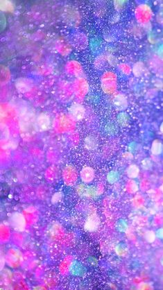 colorful bubbles are floating in the air on a purple and blue background with white dots