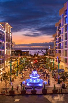 the city square is lit up at night