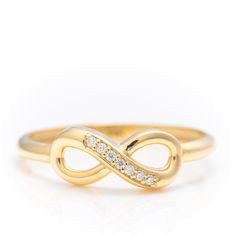 14k Solid Gold Iconic Infinity Ring, Real Gold Premium Infinity Band, Unique Design Ring For Her, Handmade Fine Jewelry By Selanica. 💙 The ring material is 14k solid gold, should not be confused with gold plating or filling. It will never tarnish or fade over time. We're offering the finest quality in solid gold jewelry. 💎 Gemstones are premium grade D Color (colorless) VS/SI clarity moissanites.  💙 Our jewelry is handcrafted with love and great care at San Francisco Bay! All of our items are 14k stamped for authenticity. You will receive them exactly as pictured.  💙 Quick shipping - Your order will be handcrafted and shipped in a few days. 🎁 They are delivered in a nice jewelry box, ready to be presented as a precious gift. 💎 Moissanite is the best alternative for natural diamonds a Gold Infinity Ring, Natural Pearl Ring, Unique Promise Rings, Infinity Band, Gold Pearl Ring, Nice Jewelry, Bezel Necklace, Precious Gift, Gold Rings Fashion