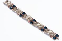 Trifari 1945 Alfred Philippe Sterling Blue Cabochon Red Crystal Leaf Bracelet Genuine Love, Leaf Bracelet, Red Crystals, Sterling Silver Bracelet, Vintage Watches, Sterling Silver Bracelets, Antique Jewelry, Vintage Antiques, Made In Usa