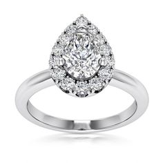 a white gold engagement ring with an oval cut diamond surrounded by small round brilliant diamonds