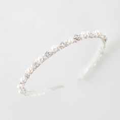 This chic bridal headband beautifully suits a range of wedding hairstyles. The wedding halo headpiece is super versatile and shapes easily into many hairstyles. This is a stunning pearl hair piece with some sparkle and perfect for the modern ethereal bride wanting to add glamour to the whimsy. MATERIALS: This exquisite crystal head piece is made with freshwater pearls and shiny Cubic zirconia crystals or rhinestones. You can choose a matching pair of wedding earrings here https://etsy.me/3ouSsVy Bridal Hairstyle Headband, Pearl Headband Wedding Hair Down, Bridal Pearl Headband, Simple Pearl Headband Wedding, Bridal Headband Pearl, Wedding Halo Headpiece, Pearl And Diamond Headband, Pearl Headpiece Wedding, Ethereal Bride