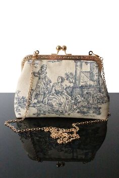 "Ideal Toile de jouy bag for Wedding day or Evening bag, in addition to be elegant, original and comfortable, this bag makes you unique. Indeed every bags in our collection are unique, everyone can have a high know how and original design bag. We always exploring new designs and details to offer the best quality as well as a large offer of bags in terms of your wishes (height, color, texture). These bags you will be essentials to put different objects and accessories. Our collection of Toile de Vintage Blue Bag For Wedding, Vintage Blue Bags For Wedding, Linen Handbags, Wedding Clutch Purse, Bag For Wedding, Spring Purses, Sew Projects, Dream Bags, Design Bag