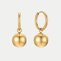 Make a statement with Aleis Earrings. Perfectly petite gold balls hang elegantly from your ears, making any outfit look instantly classic and chic. Whether you're out for a night on the town or just looking for an everyday accessory, these earrings are sure to make you shine! …………………………………. D E T A I L S • Materials: Stainless steel, 18k gold plating • Hoop Diameter: 1.6 cm (0.62 inches) • Ball Width: 1.2 cm (0.5 inch) • Earrings Length: 3.0 cm (1.1 inches) • This product is hypoallergenic, wate Gold Spherical Single Earring, Gold Sphere Single Earring, Gold Sphere Earrings For Party, Classic Gold Sphere Earrings, Gold Orb Earrings, Elegant Gold Sphere Earrings, Contemporary Fine Jewelry, Modern Muse, Free Earrings