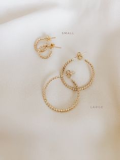 These sparkly twist Hoops are totally gorgeous and unique for everyday use and never take off. So effortless and chic with a spectacular shiny style. If you like simple, classy, and Unique hoops, these earrings are perfect for you. They make elegant, versatile hoops. Material: gold filled rose gold filled sterling silver Diameter: *small: 10mm *large: 25mm *ADDITIONAL INFORMATION* These earrings have been created by hand so no two pieces are identical. Each pair will vary in the exact size, shap Elegant Tarnish-resistant Metal Hoop Earrings, Gold Star-shaped Single Hoop Earring, Gold Star-shaped Hoop Earrings, Elegant Gold Star-shaped Hoop Earrings, Elegant Twisted Tarnish-resistant Hoop Earrings, Necklace Sizes, Two Pieces, Ring Necklace, Stone Color