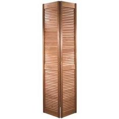 a wooden room divider with shutters on the top and bottom panels in brown