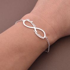 This Personalized Infinity Name Bracelet is one of the most special and personal pieces of jewelry you can own or give as a gift. This Infinity Name Bracelet is made of solid sterling silver. All items are nicely packaged ready to gift in elegant jewelry boxes. Product Description Pendant&Chain:Sterling Silver Color: silver, gold,rose gold,white gold Nameplate Width: 20-30 mm (according to the length of the names,its size is not fixed) Thickness : 1.2 mm. (approx.) ###How to order### Please choo Personalized Sterling Silver Bracelet For Birthday, Custom Name White Gold Bracelet Gift, Customized Silver Name Bracelet As Birthday Gift, Customized Silver Name Bracelet For Birthday Gift, Personalized Silver Name Bracelet For Birthday Gift, Personalized Silver Name Bracelet For Birthday, Personalized Silver Bracelet Gift, Hypoallergenic Sterling Silver Name Bracelet For Mother's Day, Hypoallergenic Sterling Silver Name Bracelet Gift