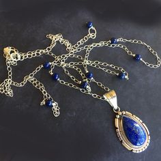 I stumbled across this stunning Native American designed pendant when I was sourcing a piece for a different project. What a find! It is a new and incredibly well designed lapis lazuli pendant in solid sterling silver. This is a one of a kind piece. See the back? To me it looks like a feather! How cool is THAT? I have wired lapis lazuli round beads in solid sterling silver chain with sterling silver wire and made this necklace with a 6" extension in the back in case you want to wear it really lo Native American Design, Lapis Lazuli Pendant, Colorful Jewelry, Silver Wire, Lapis Lazuli, Sterling Silver Chains, Round Beads, Silver Chain, Wellness Design