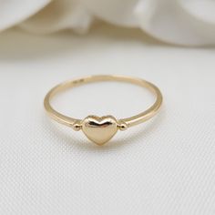 Beautiful stackable solid 14k gold mini polished yellow gold heart ring. Perfect to wear everyday, everywhere. Adorable, modern and everlasting. 14k Gold will not tarnish or rust. Perfect gift ! Materials: 14k Solid Yellow Gold Sizes: 5 to 10 Us Weight: 1.1 grams (approx) 14k stamped Brand new Fast shipping Elegant gift box included  Briza Collections is a small family owned business that works hard on providing the best selection of Fine Solid 14k Gold Jewelry for the best prices.  Our main goa Gold Heart-shaped Stackable Midi Rings, Gold Stackable Heart Midi Rings, Gold Stackable Rings With Heart Charm For Wedding, Stackable Heart Ring For Everyday And Valentine's Day, Everyday Stackable Heart Ring For Valentine's Day, Minimalist Heart Promise Ring With Polished Finish, Everyday Stackable Rings For Valentine's Day, Everyday Stackable Heart Ring, Stackable Everyday Heart Ring