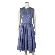 Get ready for springtime with this beautiful 1950s fit n' flare dress, in a beautiful periwinkle blue color with white floral embroidery & what looks to me like branches. This dress appears to be handmade, so its unlikely you will ever find another like it, its sleeveless, with a full skirt and a metal zipper closure up the back. LABEL: appears handmade FABRIC: - SHOULDERS: 13.5" SHOULDER TO WAIST: 16.5" BUST: 35" WAIST: 26" LENGTH: 45" SWEEP: approx 75" flat CONDITION: great, see photos- has belt loops and no belt, seam gap around collar, some loose threads around armholes, seam gap at back left armhole with threads sticking out PINNED TO MODEL?: no ☝For reference Mod's measurements are S 11", B 32.5", W 24", H 32.5"☝ [J1874] This way for more Storyland Vintage! ↣ https://www.etsy.com/sho 1950s Tea Length Spring Dresses, Blue Vintage Dress For Spring Daywear, Spring Blue Cotton Vintage Dress, Spring Blue Vintage Cotton Dress, Blue Knee-length Cotton Vintage Dress, 1950s Style Blue Spring Dress, Vintage Blue 1950s Style Spring Dress, 1950s Style Cotton Blue Dress, 1950s Style Blue Cotton Dress