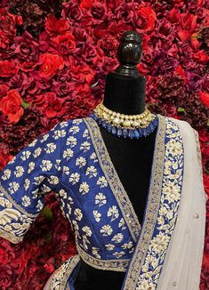 Subtle hues of whimsy blend with floral embroideries in this Royal Blue lehenga. The mehreen lehenga, embroidered with beautiful floral motifs and golden embroidery work, looks every bit of the royal self! Color - Fabric & Work Style -- Silk lehenga: Rich embroidery, floral embroidery work.- Silk embroidered blouse.- Net dupatta. Details -- Assured quality.- Wash care instruction: Dry clean only.- Slight variation in color is possible due to digital photography. Chanderi Lehenga With Intricate Embroidery For Navratri, Traditional Chanderi Lehenga For Reception, Reception Chanderi Lehenga With Traditional Drape, Chanderi Lehenga For Reception With Traditional Drape, Embroidered Lehenga For Reception Navratri, Embroidered Lehenga For Reception And Navratri, Embroidered Lehenga For Reception During Navratri, Diwali Chanderi Lehenga With Intricate Embroidery, Elegant Kundan Sharara With Intricate Embroidery