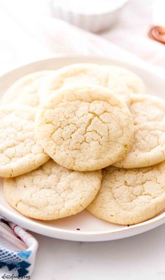 a white plate topped with cookies on top of a table