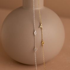 Add a touch of personal elegance to your attire with our Sideways Initial Heart Necklace, a beautifully designed piece that blends a heart-shaped pendant with your chosen initial. Crafted with precision and attention to detail, it's a versatile accessory that symbolizes love and individuality ♡ Material: High Quality Solid 925 Sterling Silver Finish: Sterling Silver ∙ 18K Gold ∙ Rose Gold Dimension: 7mm letter height Design will come in all capital letters unless specified otherwise Size: The to Mother's Day Heart Necklace With Adjustable Initial Pendant, Adjustable Initial Pendant Necklace For Valentine's Day, Valentine's Day Necklace With Initial Pendant, Silver Heart Pendant Initial Necklace, Silver Heart Initial Necklace For Valentine's Day, Silver Heart Initial Pendant Necklace With Adjustable Chain, Elegant Silver Heart Pendant Initial Necklace, Elegant Silver Heart Initial Necklace, Elegant Silver Initial Necklace For Valentine's Day