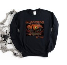 Halloweentown Est 1998 Tee/Sweatshirt Comes in 4 colors - White, Ash Grey, Tan and Black Tee: $32Sweatshirt: $48Unisex sizing Sizes: S-4XLTAT: 7-10 business days 90s Long Sleeve Sweatshirt For Fall, 90s Long Sleeve Fall Sweatshirt, 90s Style Long Sleeve Fall Sweatshirt, 90s Fall Streetwear Sweater, 90s Style Fall Sweater For Streetwear, Vintage Halloween Sweatshirt For Streetwear, 90s Graphic Print Fall Sweatshirt, 90s Cotton Sweatshirt For Fall, 90s Style Cotton Sweatshirt For Fall