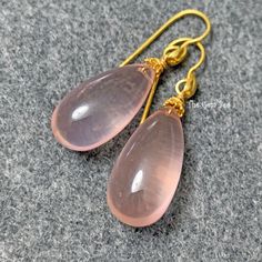 Thank you for coming in! Spectacular 18K solid yellow gold earrings with finest rose quartz smooth teardrop briolettes! It looks much much nicer in person! DIMENSION: 11mmx22mm stones, 1.5 Inch Total Length. WEIGHT: Appr. 42 Carats MATERIAL: 18K Solid Yellow Gold, Rose Quartz Elegant Teardrop Rose Quartz Earrings, Briolette Earrings, Yellow Gold Earrings, Yellow Gold Earring, Solid Yellow, Gold Rose, Rose Quartz, Jewelry Earrings Dangle, Gold Earrings