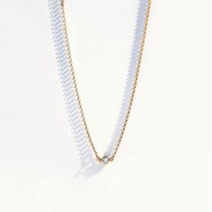 "Highlight your collarbone with our timeless single diamond choker necklace. Featuring an 'AAA' grade CZ and adjustable chain, it's a delicate diamond necklace you can wear on any occasion. Wear it solo or layer with longer necklaces for a dramatic layered look. This necklace turns heads despite its dainty look. Crafted in our studio from genuine 14k gold filled metal. About 14k gold filled metal: Gold-filled jewelry has 100x more gold alloy than gold plated jewelry. Far superior to regular 'gol Delicate Diamond Necklace, Silver Bar Bracelet, Raw Quartz Necklace, Herkimer Diamond Necklace, Diamond Choker Necklace, Choker Gold, Raw Crystal Necklace, Diamond Choker, Gold Diamond Necklace