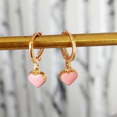 Light Pink Enamel  Heart Earrings. Sweet little Heart Earrings to make you smile. 2 earrings. Treat yourself on Valentines Day  Modern classic small golden hoop huggie hoops.  The earrings open with a simple lever. Lightweight simple design, very easy to wear everyday, you won't even feel you're wearing any. Materials Hoops are high quality gold plate over brass with a stainless steel post.  Perfect for sensitive ears.  To keep your jewellery looking fabulous do not get wet, any moisture will ru Smile 2, Pink Heart Earrings, Earrings Gold Hoop, Golden Hoops, Heart Earring, 2 Earrings, Small Hoop Earrings, Steel Post, Pink Enamel