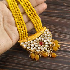 This is a stunning handmade necklace perfect for high end Jewelry Collector, a keeper in Traditional Vintage Indian/Pakistani Bridal jewelry and a Luxury Gift for your Daughter, Sister or Wife on Wedding or Anniversary. Perfect for any type of occasions, weddings And celebrations and a beautiful & memorable gift for weddings and special occasions.  Item Code:- L5087 -Yellow Beaded Necklace Set with Earrings. -Designer multi layered faceted Yellow beaded necklace. -Gold Plated Set with Kundan Sto Yellow Beaded Necklace, Pakistani Bridal Jewelry, Necklace Set With Earrings, Polki Necklace, Pakistani Jewelry, Kundan Necklaces, Vintage Indian, Pakistani Bridal, Brass Earrings