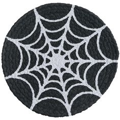 a black and white spider web pattern on a round rug