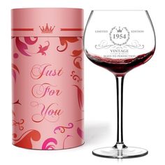 a wine glass next to a canister with the words just for you printed on it