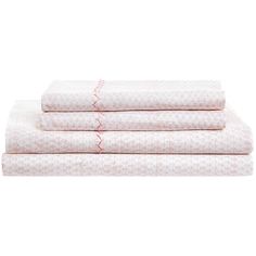 three sheets with pink and white designs on them