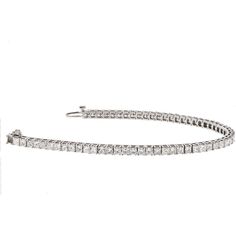 Indulge in the timeless elegance of our 14K White Gold 7 Carat Princess Cut One Line Tennis Bracelet. This exquisite piece is meticulously crafted in 14K white gold and adorned with a dazzling array of 7.70 carats of princess cut diamonds. Every diamond is carefully selected for its exceptional brilliance and fire, creating a captivating sparkle that will mesmerize onlookers.Designed to be worn effortlessly from day to night, this tennis bracelet is 7 inches long, draping gracefully around your Princess Cut Gold, Diamond Birthstone, Tennis Necklace, Diamond Design, Princess Cut Diamonds, Brilliant Diamond, Metal Bracelets, Tennis Bracelet, Eternity Bands