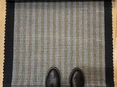 a pair of shoes sitting on top of a rug