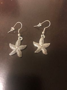 These silver earrings are beautiful starfish. The starfish are about 1 inch long.  Great gift for a loved one, that special starfish. Elegant Handmade Starfish Earrings, Silver Starfish-shaped Jewelry Gift, Nickel Free Starfish Jewelry In Ocean-inspired Style, Silver Starfish Jewelry For Gifting, Nickel-free Starfish Jewelry With Ocean-inspired Style, Silver Starfish Jewelry As Gift, Silver Starfish Jewelry For Gifts, Nickel-free Starfish Shaped Ocean-inspired Jewelry, Nickel-free Star-shaped Ocean-inspired Jewelry