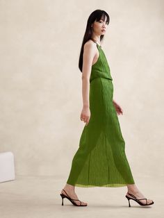 This maxi skirt is designed to stun with a timeless column silhouette, cut from a semi-sheer crinkle fabric we love for its luxurious texture.  High rise, column fit.  Elastic waist with invisible side zip.  Lined to mini length.  High rise, column fit.  Maxi length.  Model: Size S, 5'10" (178cm). Palm Green, Crinkle Fabric, Silhouette Cut, Summer Sale, New Woman, First Look, Side Zip, Fashion News, Banana Republic