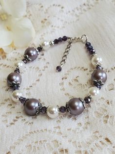 $20.95 Elegant Beaded Lavender Bracelets, Elegant Lavender Beaded Bracelets, Elegant Lavender Beaded Bracelet, Elegant Lavender Adjustable Bracelets, Elegant Adjustable Lavender Bracelet, Elegant Purple Pearl Bracelet With Round Beads, Handmade Elegant Purple Pearl Bracelet, Elegant Handmade Purple Pearl Bracelet, Pearl Beaded Bracelet