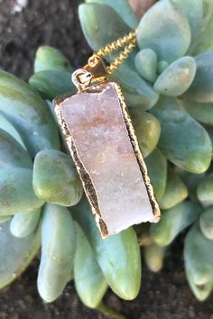 "Beautiful gold dipped and gold edged white raw druzy quartz pendant on gold colored clasp chain necklace. The rectangular prism shaped crystal is about 1\" long and 0.5\" wide. Please note that no two stones are alike and therefore color, shape and size may vary slightly. You can choose your necklace length from the drop-down menu. In case you would like a length besides the listed options, leave a note at checkout. Item will be shipped 1 - 2 business days after purchase. Back to my shop with i Gold Jewelry With Large Stone For Gift, Healing Gold Necklaces With Raw Stone, Gold Mineral Crystal Spiritual Necklace, Gold Spiritual Mineral Crystal Necklace, Gold Necklace With Raw Stone, Gold Mineral Crystal Necklaces With Spiritual Style, Spiritual Gold Necklace With Raw Stone, Gold Agate Gemstone Jewelry, Gold Quartz Jewelry With Raw Stone