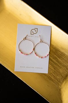 Add a playful touch to your outfit with Just Jill's Seed Bead Hoop Earrings! These gold drop hoops feature dainty pink and white beads, bringing a pop of color to any look. Pink Hoop Earrings For Everyday, Small Pink Hoop Earrings For Everyday, Pink Small Hoop Earrings For Everyday, Pink Hoop Jewelry For Summer, Everyday Pink Beaded Jewelry, Small Pink Hoop Earrings Nickel Free, Pink Tiny Beads Jewelry For Everyday, Dainty Pink Hoop Jewelry, Dainty Pink Hoop Earrings For Everyday