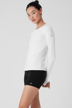 Bring the feels. The Alosoft Finesse Long Sleeve is made with soft performance jersey and has a comfy, relaxed silhouette, so you can stay cozy and on-trend from yoga to lounge. Looks so good layered under jackets. Everyday Athleisure Tops With Thumbholes, Long Sleeve Moisture-wicking Activewear, Long Sleeve Moisture-wicking Activewear For Layering, Basic Long Sleeve Stretch Activewear, Basic Stretch Long Sleeve Activewear, Minimal Stretch Athleisure Activewear For Fall, Fall Athleisure Activewear With Minimal Stretch, Functional White Everyday Activewear, Sporty Tops With Minimal Stretch For Layering