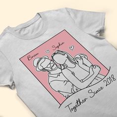 Finding the perfect gift for your favorite couple? These matching personalized shirts are a thoughtful and unique present they'll adore! Surprise them on their anniversary, birthday, or another special occasion with matching tees celebrating their partnership. Or give them as a cute gift for any weekend or date night - they'll love wearing them together while running errands, cuddling at home, or being out on the town. Every time they slip them on, they'll be reminded of your thoughtful, couple- Anniversary Crew Neck T-shirt With Custom Print, Family Matching Graphic Print T-shirt As Gift, Couples Style Tops For Valentine's Day Gift, Casual Tops With Custom Artwork For Gift, Casual Tops With Custom Artwork As Gift, Personalized Mother's Day T-shirt With Custom Text, Custom Text T-shirt For Mother's Day Personalized Gift, Custom Text T-shirt For Mother's Day Gift, Custom Artwork Short Sleeve T-shirt For Gift