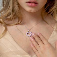 Looking for a special gift for your little princess? This gorgeous open heart pendant sparkles brightly with multiple pretty pink cubic zirconias. Crafted entirely of 925 sterling silver which is suitable for those with sensitive skin. This necklace rests on a beautiful matching link chain and comes neatly packaged in its own little gift box! Age Group: Lovely for Young Girls and Pre-Teens; Safe for Sensitive Skin Material: 925 Sterling Silver Heart Size: 17mm x 18mm Open heart, prong set (pink) Pink Double Heart Jewelry Gift For Her, Pink Heart Cut Jewelry As Gift For Her, Pink Heart Cut Jewelry Gift For Her, Pink Cubic Zirconia Pendant Necklace, Pink Cubic Zirconia Heart Necklace, Pink Heart Cut Cubic Zirconia Necklace, Pink Round Necklace For Valentine's Day, Cute Pink Sterling Silver Jewelry, Pink Heart Cut Necklace As Gift For Her