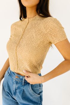 this not-so-basic cropped top will take you from day to night, season after season. made in the perfect neutral tan color, it’s slightly sheer + has a chic high neckline. a must-have ‘going out’ top or elevated basic top to add to your spring // summer wardrobe. tan // high neckline, mesh overlay, attached tank lining, adjustable lining straps, seam detailing, cropped paired with our corbin pleated denim model is 5'8" + wearing a small measurements are approximate + taken while laying flat small Chic High Neck Mesh Top For Summer, Beige Crop Top For Spring Night Out, Beige Crop Top For Night Out In Spring, Chic High Neck Crop Top For Summer, Trendy Cropped Beige Top, Spring Sheer Cropped Crop Top, Chic Cropped Fitted Mesh Top, Chic Fitted Cropped Mesh Top, Chic Cropped Sheer Mesh Top