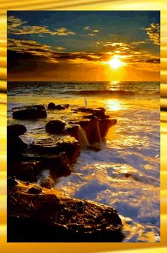 the sun is setting over the ocean with rocks in the foreground and waves on the water