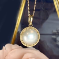 One piece of Bold Statement piece, Large Genuine White Mabe Pearl Enhancer Pendant * Center stone: Genuine White Mabe Pearl, 15-16mm in size * Pendant size: 29mm x 19.5mm including bail. Bail size approx. 4mm * Metal: 14K yellow gold * Stamp: 14k * Chain is not included, can be purchased in our shop. ❤️Follow us on Instagram @ elekalonjewelry for latest projects and designs. *If you have any questions, please feel free to message us. Elegant Yellow Gold Jewelry With Cabochon, Elegant Yellow Gold Cabochon Jewelry, Yellow Gold Round Cabochon Jewelry, Timeless White Gold Jewelry With Cabochon, Yellow Gold Cabochon Jewelry, Luxury Round Cabochon Jewelry, Pearl White Pendant Fine Jewelry, Yellow Gold Cabochon Round Pendant Jewelry, Exquisite Pearl White Pendant Necklace