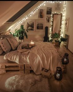 a bedroom with lots of lights on the ceiling and bed made out of wooden pallets